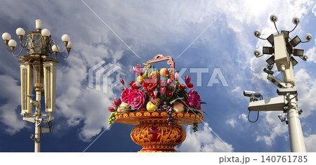 Street lamp and huge flower basket (against the background of a beautiful sky with clouds) in Tiananmen square, Beijing, China Street lamp and huge flower basket (against the background of a beautiful sky with clouds) in Tiananmen square, Beijing, China 140761785