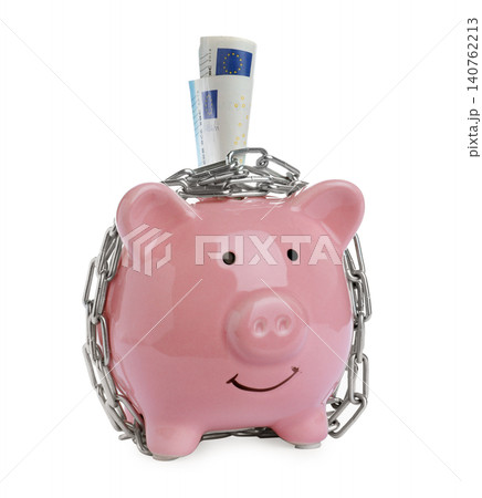 Piggy bank with steel chain and banknotes isolated on white. Money safety concept Piggy bank with steel chain and banknotes isolated on white. Money safety concept 140762213