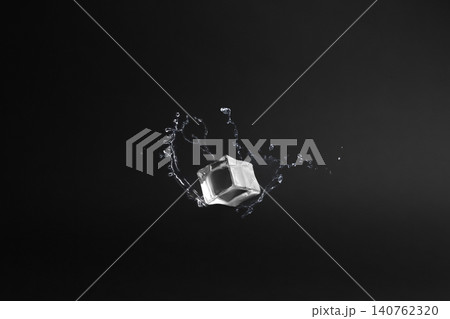 Crystal clear ice cube on black background Crystal clear ice cube on black background 140762320