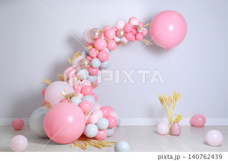 Beautiful composition with balloons and spikelets near light wall Beautiful composition with balloons and spikelets near light wall 140762439