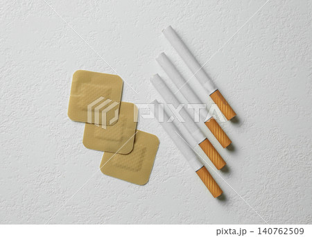 Nicotine patches and cigarettes on white background, flat lay 140762509