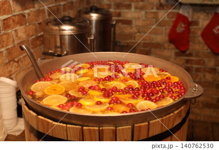 Large cauldron with tasty mulled wine at winter fair Large cauldron with tasty mulled wine at winter fair 140762530