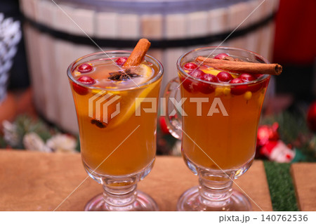 Tasty aromatic mulled wine on wooden table Tasty aromatic mulled wine on wooden table 140762536