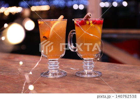 Tasty aromatic mulled wine on wooden table Tasty aromatic mulled wine on wooden table 140762538