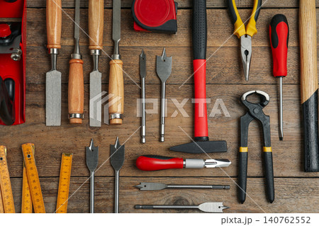 Flat lay composition with carpenter's tools on wooden background 140762552