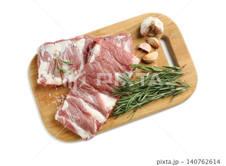 Raw ribs with rosemary, salt and garlic on white background, top view 140762614