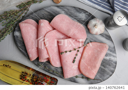 Tasty ham served on light grey table, flat lay Tasty ham served on light grey table, flat lay 140762641