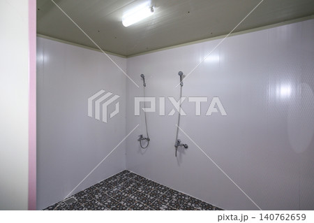 Interior of a Clean Communal Public Shower Room Facility 140762659