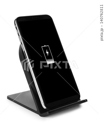 Mobile phone charging with wireless pad isolated on white 140762811