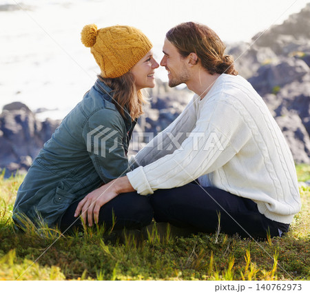 Happy, couple and together in nature or sitting on grass, hilltop and scenery or people looking with love. Care, smile and romantic date on winter vacation, holiday and relationship in Sweden Happy, couple and together in nature or sitting on grass, hilltop and scenery or people looking with love. Care, smile and romantic date on winter vacation, holiday and relationship in Sweden 140762973