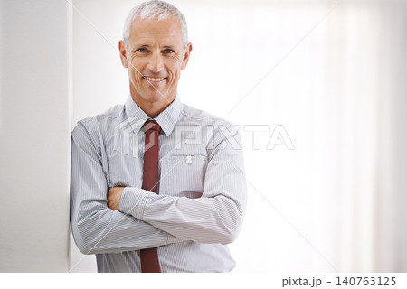 Portrait, senior man and professional with arms crossed, mockup space or agent in workplace. Face, mature person or entrepreneur with confidence or employee with startup or corporate with business Portrait, senior man and professional with arms crossed, mockup space or agent in workplace. Face, mature person or entrepreneur with confidence or employee with startup or corporate with business 140763125