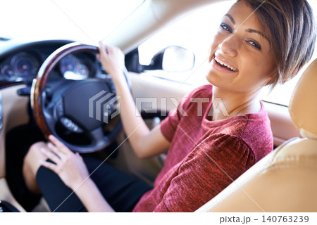 Portrait, driving and business woman with travel on morning commute, road trip or journey to work. Smile, transport and happy driver at wheel of car with confidence, test drive and auto insurance. Portrait, driving and business woman with travel on morning commute, road trip or journey to work. Smile, transport and happy driver at wheel of car with confidence, test drive and auto insurance. 140763239