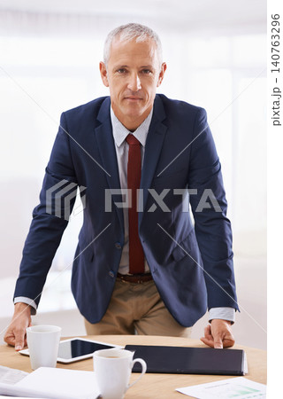 Serious, office and portrait of business man with confidence for career, job and working. Professional, corporate agency and senior person at desk for company pride, startup and entrepreneurship Serious, office and portrait of business man with confidence for career, job and working. Professional, corporate agency and senior person at desk for company pride, startup and entrepreneurship 140763296