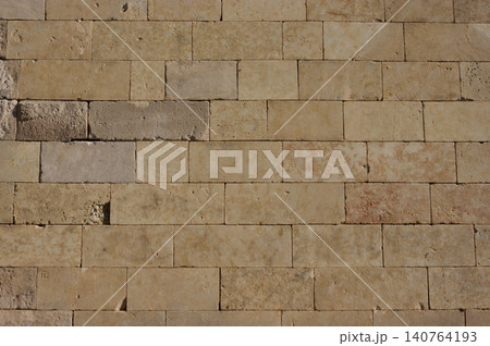 Block of stone wall without spaces 140764193