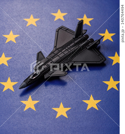 A fighter jet on the European Union flag as a conceptual backdrop representing Europe's defense A fighter jet on the European Union flag as a conceptual backdrop representing Europe's defense 140764494