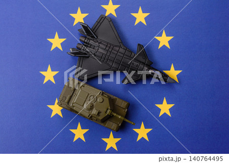A fighter jet on the European Union flag as a conceptual backdrop representing Europe's defense 140764495