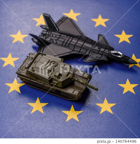 A fighter jet on the European Union flag as a conceptual backdrop representing Europe's defense A fighter jet on the European Union flag as a conceptual backdrop representing Europe's defense 140764496