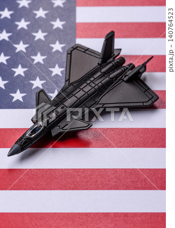 A fighter jet against the US flag as a conceptual background representing defense A fighter jet against the US flag as a conceptual background representing defense 140764523