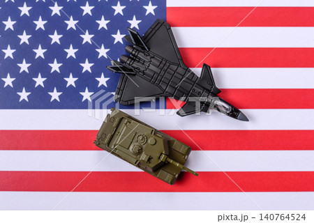 A fighter jet against the US flag as a conceptual background representing defense 140764524