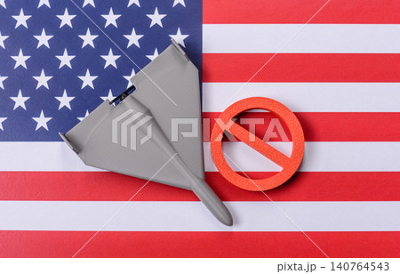 A Shahed drone featuring a prohibition symbol on the US flag, serving as a conceptual background A Shahed drone featuring a prohibition symbol on the US flag, serving as a conceptual background 140764543