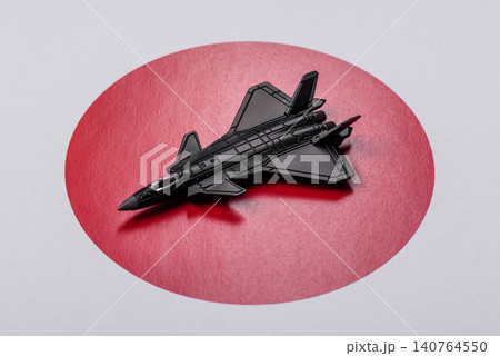 A fighter jet against the Japanese flag as a conceptual background representing defense A fighter jet against the Japanese flag as a conceptual background representing defense 140764550