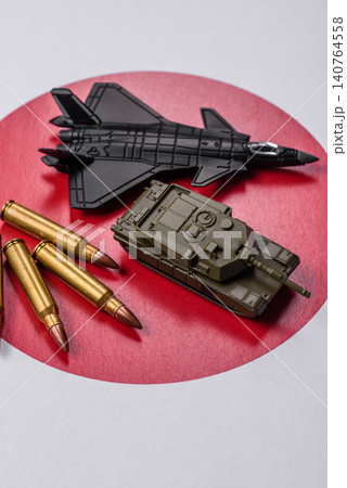 A fighter jet against the Japanese flag as a conceptual background representing defense 140764558