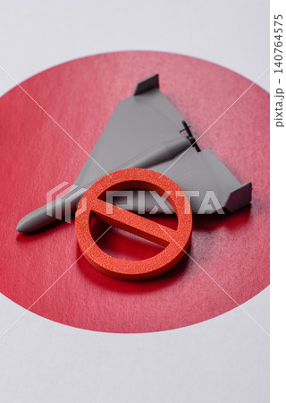 A Shahed drone featuring a prohibition symbol on the Japanese flag as a conceptual background A Shahed drone featuring a prohibition symbol on the Japanese flag as a conceptual background 140764575