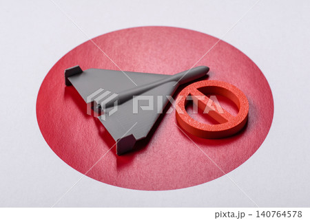 A Shahed drone featuring a prohibition symbol on the Japanese flag as a conceptual background A Shahed drone featuring a prohibition symbol on the Japanese flag as a conceptual background 140764578