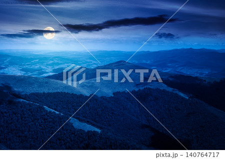 mysterious mountain landscape in summer at night. travel ukraine background. full moon over rolling hill in dappled light. scenic view of borzhava ridge. carpathian mountain scenery 140764717