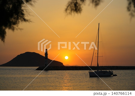 Seascape at sunshine. Lighthouse and sailings on the coast. Seaside town of Turgutreis and spectacular sunshine Seascape at sunshine. Lighthouse and sailings on the coast. Seaside town of Turgutreis and spectacular sunshine 140766114
