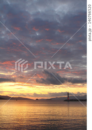 Seascape at sunshine. Lighthouse and sailings on the coast. Seaside town of Turgutreis and spectacular sunshine Seascape at sunshine. Lighthouse and sailings on the coast. Seaside town of Turgutreis and spectacular sunshine 140766520