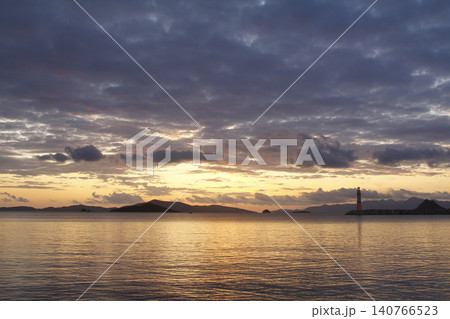 Seascape at sunshine. Lighthouse and sailings on the coast. Seaside town of Turgutreis and spectacular sunshine Seascape at sunshine. Lighthouse and sailings on the coast. Seaside town of Turgutreis and spectacular sunshine 140766523