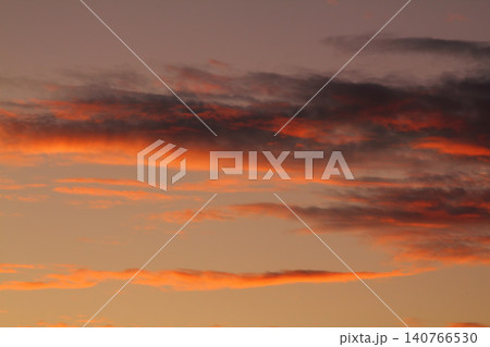Dramatic red and orange sky and clouds abstract background. Red-orange clouds on sunset sky. Warm weather background. Art picture of sky at dusk 140766530