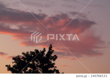 Dramatic red and orange sky and clouds abstract background. Red-orange clouds on sunset sky. Warm weather background. Art picture of sky at dusk Dramatic red and orange sky and clouds abstract background. Red-orange clouds on sunset sky. Warm weather background. Art picture of sky at dusk 140766531