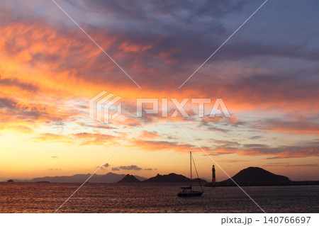 Seascape at sunshine. Lighthouse and sailings on the coast. Seaside town of Turgutreis and spectacular sunshine 140766697