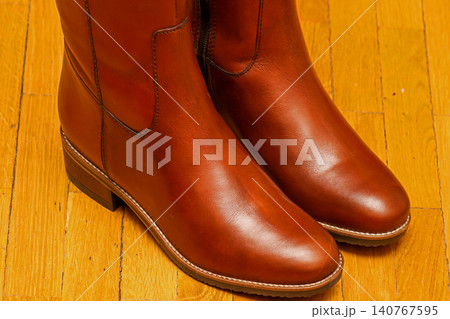 Brown leather boots detail Brown leather boots detail 140767595