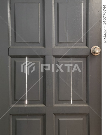Gray Wooden Door Panels with Light Beams Gray Wooden Door Panels with Light Beams 140770744