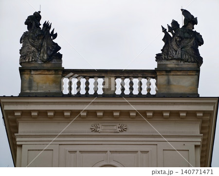 Urban rooftop range displaying weathered stone sculptures with atmospheric sky contrast and cinematic appeal Urban rooftop range displaying weathered stone sculptures with atmospheric sky contrast and cinematic appeal 140771471