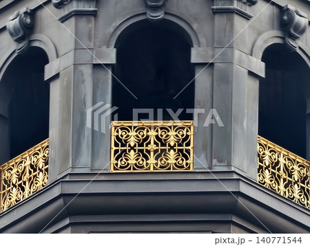 Refined decorative ornament showcasing intricate metal craftsmanship within shadowed stone framework Refined decorative ornament showcasing intricate metal craftsmanship within shadowed stone framework 140771544