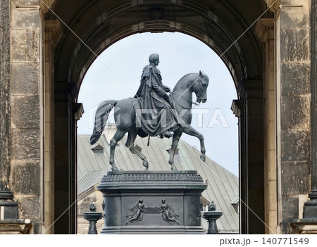 Elegant royal sculpture. Statue of regal monarch atop tranquil horse inside historical museum setting Elegant royal sculpture. Statue of regal monarch atop tranquil horse inside historical museum setting 140771549
