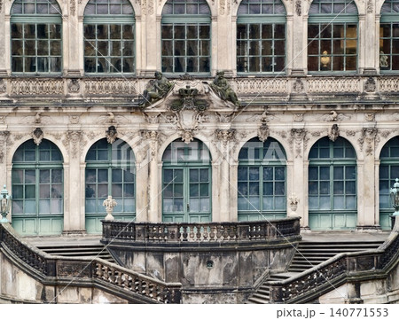 Close inspection of historic window and balustrade exhibiting signs of aging and preservation needs Close inspection of historic window and balustrade exhibiting signs of aging and preservation needs 140771553