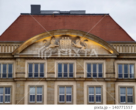 Elegant decorative building. Architectural monument featuring sculptures and classic design Elegant decorative building. Architectural monument featuring sculptures and classic design 140771557