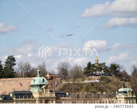 Skyline including historic domes. Aerial scene of historic buildings with approaching airplane Skyline including historic domes. Aerial scene of historic buildings with approaching airplane 140771685