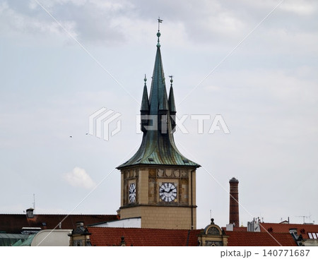 Old civic monument with pointed spire and verdigris copper coating dominates traditional skyline Old civic monument with pointed spire and verdigris copper coating dominates traditional skyline 140771687