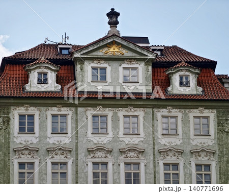 Refined building with decorative features. Charming old residence with ornate architectural details Refined building with decorative features. Charming old residence with ornate architectural details 140771696