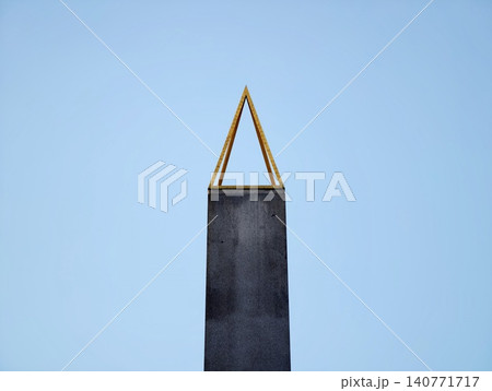 Architectural landmark showcasing clean modern lines and textured metal finishing against clear sky Architectural landmark showcasing clean modern lines and textured metal finishing against clear sky 140771717