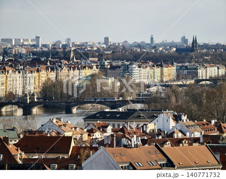 Expansive urban river. Panoramic river view showcasing sprawling urban environment and structures Expansive urban river. Panoramic river view showcasing sprawling urban environment and structures 140771732