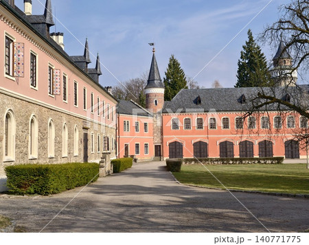 Pink estate with spacious gardens. Grand pink chateau with symmetrical wings and vibrant open space 140771775