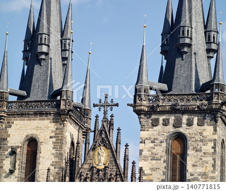 Richly detailed vertical architectural features with textured surfaces and ornamental tracery Richly detailed vertical architectural features with textured surfaces and ornamental tracery 140771815