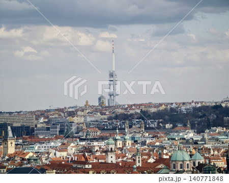 Media tower stands against cloudy skyline. Iconic tower shapes urban visual narrative today Media tower stands against cloudy skyline. Iconic tower shapes urban visual narrative today 140771848